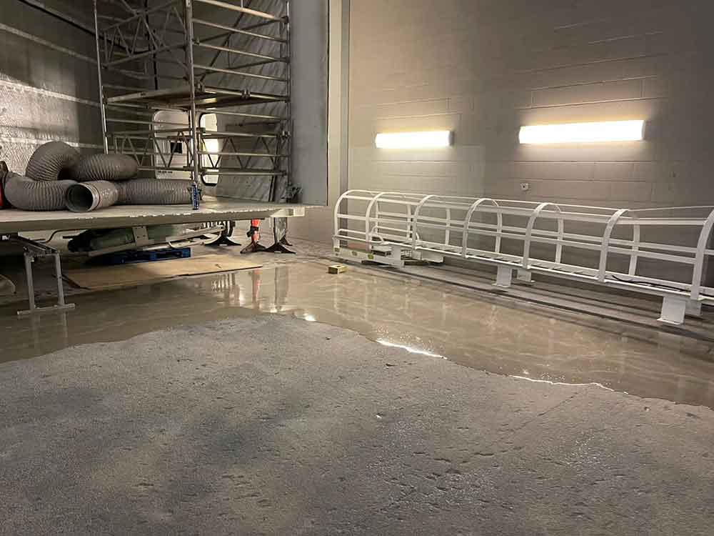 Flowscreed applied to floor and Mclaren plant